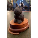 A German Black Forest type prisoner of war table lighter, in the form of a dog detaching and