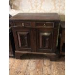 An 18th Century style oak cabinet, rectangular top above a single frieze moulded fitted drawers,