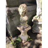 Garden statuary, a stone bust of a lady on a plinth