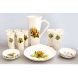 A French 1950s pottery water set decorated with orange flowers, marked 'M.B.F.A. Pornic', comprising