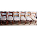 A set of six mid Victorian elm and beech dining chairs, upholstered seats, with a pair of early 19th