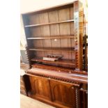 A Victorian mahogany library open bookcase, moulded cornice above adjustable shelves, twisted