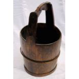 A 19th century oak and metal cooper shaped bucket. 62cm H
