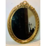 A 19th French giltwood and gesso oval mirror. 105cm H