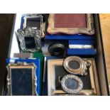 A collection of boxed and unboxed modern silver hallmarked mounted easel photograph frames, a