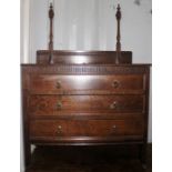 An early 20th Century oak bedroom dressing chest, fitted with three long drawers, raised on square