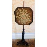 A Victorian mahogany pole screen, circa 1880, octagonal frame with tapestry inlay on a reeded