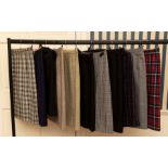 All new samples. Eleven assorted Tweed and Tartan pencil skirts by Daks. All samples are sizes 10/