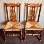 A pair of Arts & Crafts elm rush seated, circa 1910, in a late 18th/19th century manner,