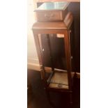 An Edwardian crossbanded mahogany pedestal glazed cabinet, single drawer, raised on tapered