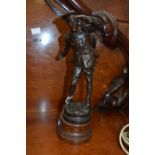 Early 20th Century bronzed figure of a WWI soldier, on wooden stand CR Damage to rifle