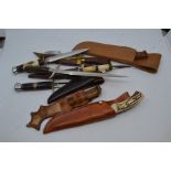 A group of various vintage and recent fixed blade knives, including a Mauser full tang with stag