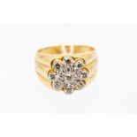 A diamond and 14ct gold cluster ring the top claw set with round brilliant cut diamonds in the
