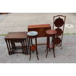 A collection of furniture, comprising an Edwardian mahogany Sutherland table, a nest of tables,