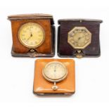 Three leather cased travel clocks, the eight day 'pocket watch' movements in square cases, two at