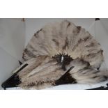 A collection of vintage feathers, morning fans, other early 20th Century ladies fans, including