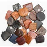 Twenty-five various recent and vintage leather and crocodile gentleman's coin holders. (25)