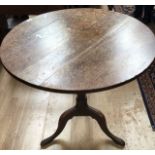 A George III large oak plank tilt top tripod table, a pair of George I elm side chairs and a