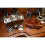 A Victorian Gothic walnut tea caddy, the domed lid and front applied with decorative brass and ivory