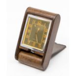 A Jaeger-LeCoultre leather-cased travel alarm clock, with eight day movement in patterned tan