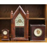 Three various clocks, comprising an American rosewood veneered mantle clock, an oak box mantle