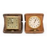 Two American Waltham leather cased travel clocks, the eight day 'pocket watch' movements in square