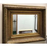 Gilt framed rectangular wall mirror with bevelled glass, 29cm by 39cm