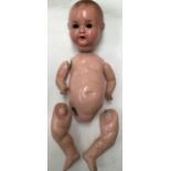 Armand Marseille baby doll, head mark 518/6K. 22”, limbs detached, damage to hands, no eyes. Along