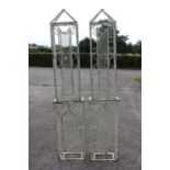 Two white steel cages, pierced, each measuring approx. 205cm high, 40cm wide, 19cm deep (2)