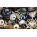 A large collection of Booths blue and white Willow Pattern, tea and dinner services with tureens,