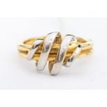 A 14ct gold two tone ring, the yellow band with overlaid white gold coil to the top, size Q,