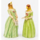 A pair of Royal Worcester figural candle snuffers, in the form of opera singers, probably Confidence