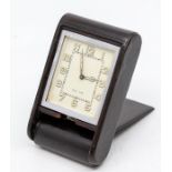 A Jaeger-LeCoultre leather-cased travel clock, with eight day movement in dark burgundy folding
