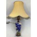 A Doulton Burslem table lamp, early 20th Century, hand painted decoration on a blush ivory ground