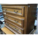 A contemporary oak veneered chest of drawers, a matching side cabinet and a solid golden oak