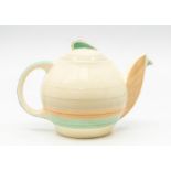 A Susie Cooper teapot and cover Condition: Chip to spout. Crazing to body, especially around the