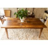 An oak refectory type table, of recent manufacture, the plank top raised on tapering square