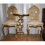 A pair of French style giltwood side chairs with canework backs, and a gilt occasional table (3)