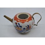 A Chinese Imari bullet shaped teapot, brass spout and handle