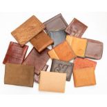 Sixteen various recent and vintage gentleman's crocodile wallets in tan and brown tones. (16)