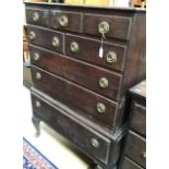 A George II oak chest on stand, circa 1750, fitted with three drawers, over two doors, and two