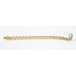 A two tone 9ct gold bracelet, fancy oval open links set to the centre with white gold discs, trigger