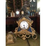 A 19th Century spelter and gilded figural mantle clock, with a white enamelled dial, together with a