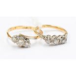 A three stone diamond 18ct gold ring, claw set with old European cut diamonds, total diamond