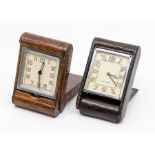 A Jaeger-LeCoultre crocodile cased travel clock, with eight day movement in dark brown folding case,