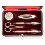 A George V silver boxed manicure set, Birmingham 1924, by Deakin & Francis, comprising a powder pot,