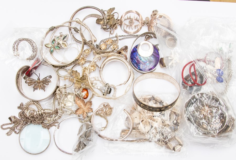 A collection of silver, unmarked white metal possibly continental silver and white metal jewellery