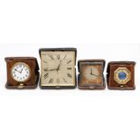 Three leather cased travel clocks, the Swiss eight day 'pocket watch' movements in square cases, 9-