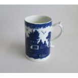 A Lowestoft Mug, Blue and White transfer printed with additional washes in under glazed blue in a