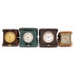 Three leather cased travel clocks, the Swiss eight day 'pocket watch' movements in square cases, 9-